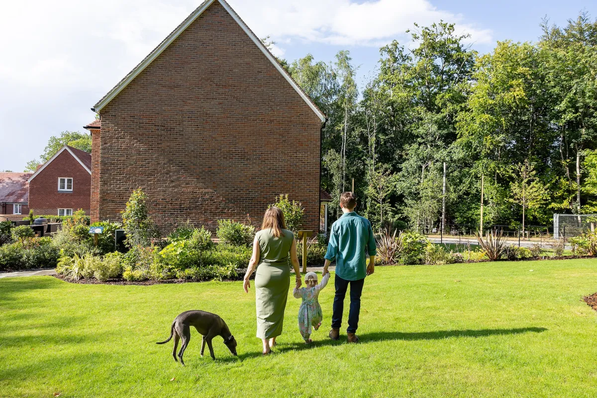 Amy and Alex Vickery with their child and dog